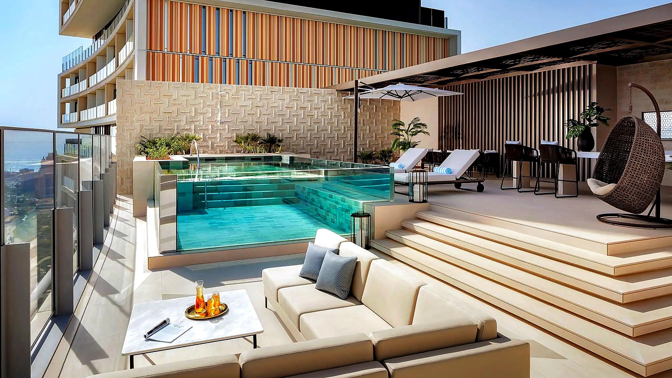 Private rooftop infinity pool and sun loungers at Skyscape Penthouse Atlantis The Royal Dubai