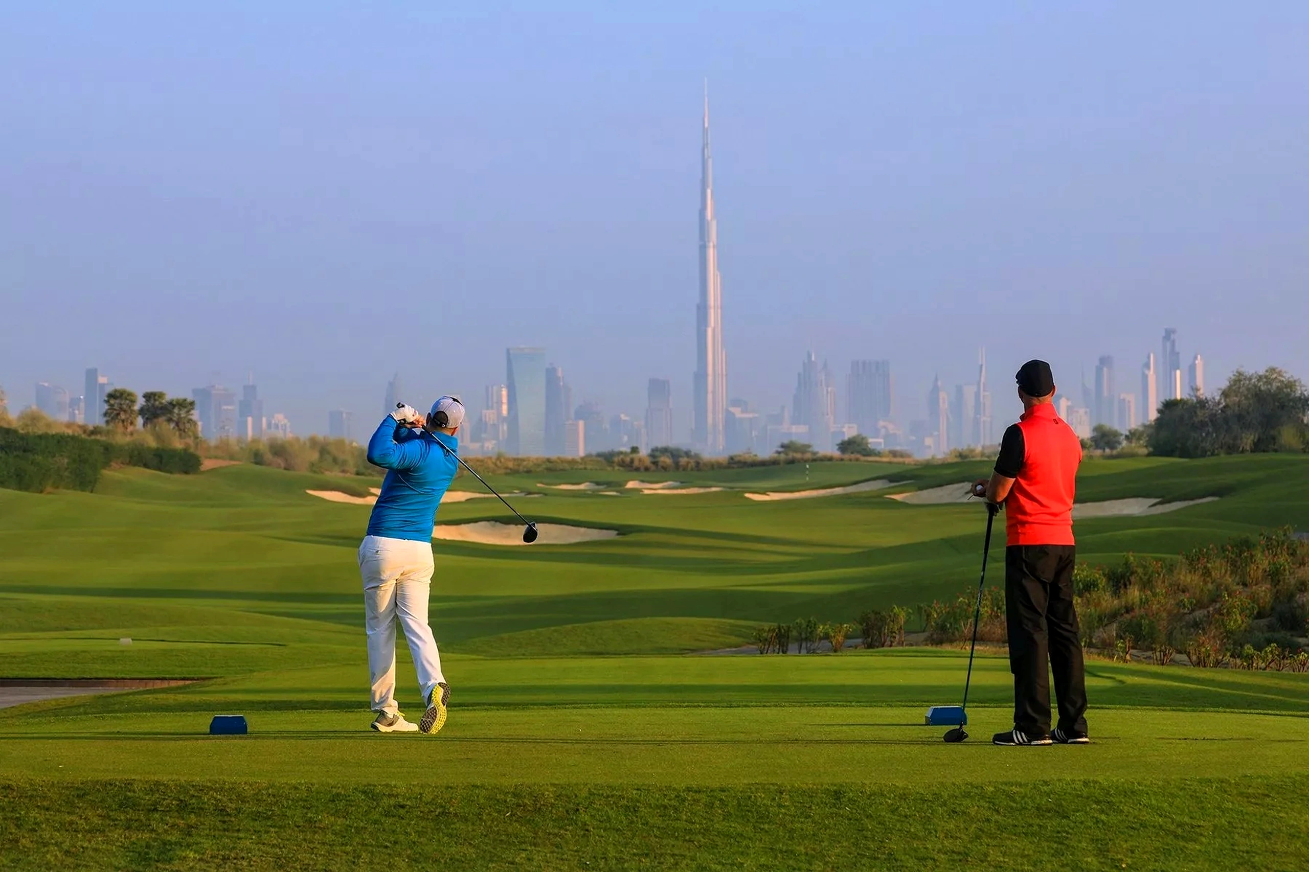 Golfer on the pristine putting green during a tournament event at Dubai Hills Golf Club managed by Troon International