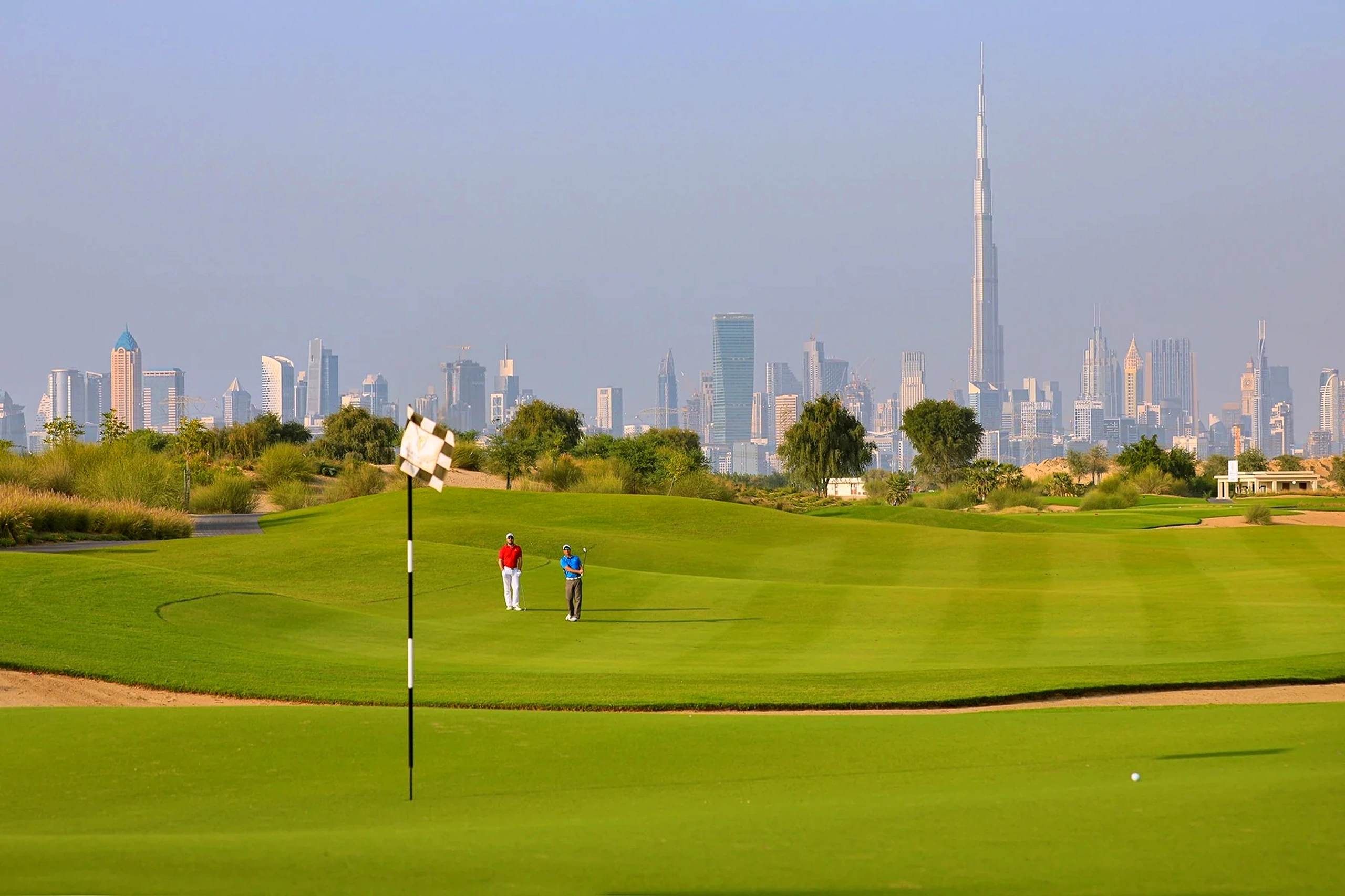 Undulating fairways and pristine water hazards across the 18-hole par 72 championship layout at Dubai Hills Golf Club