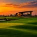 Panoramic golden hour sunset over the championship fairways, putting green, and modern clubhouse at Trump International Golf Club Dubai